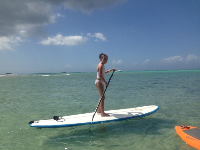 9 years old and already a pro at stand up paddling